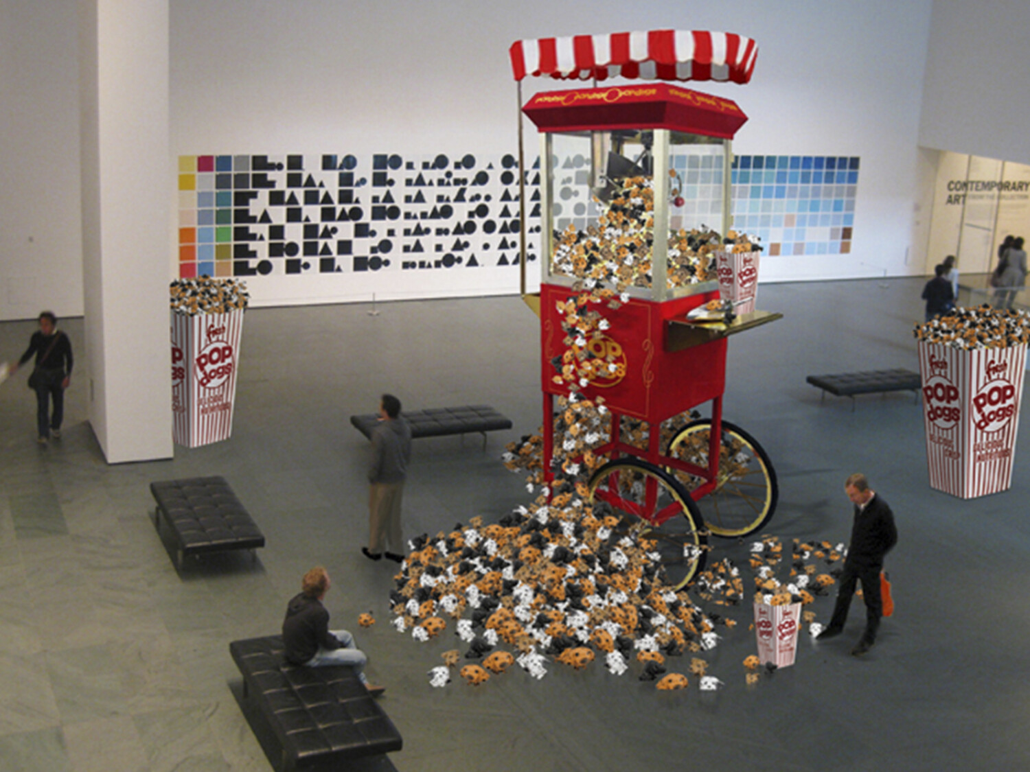 a large red and white cart with popcorn scattered on it. Carlo Sampietro