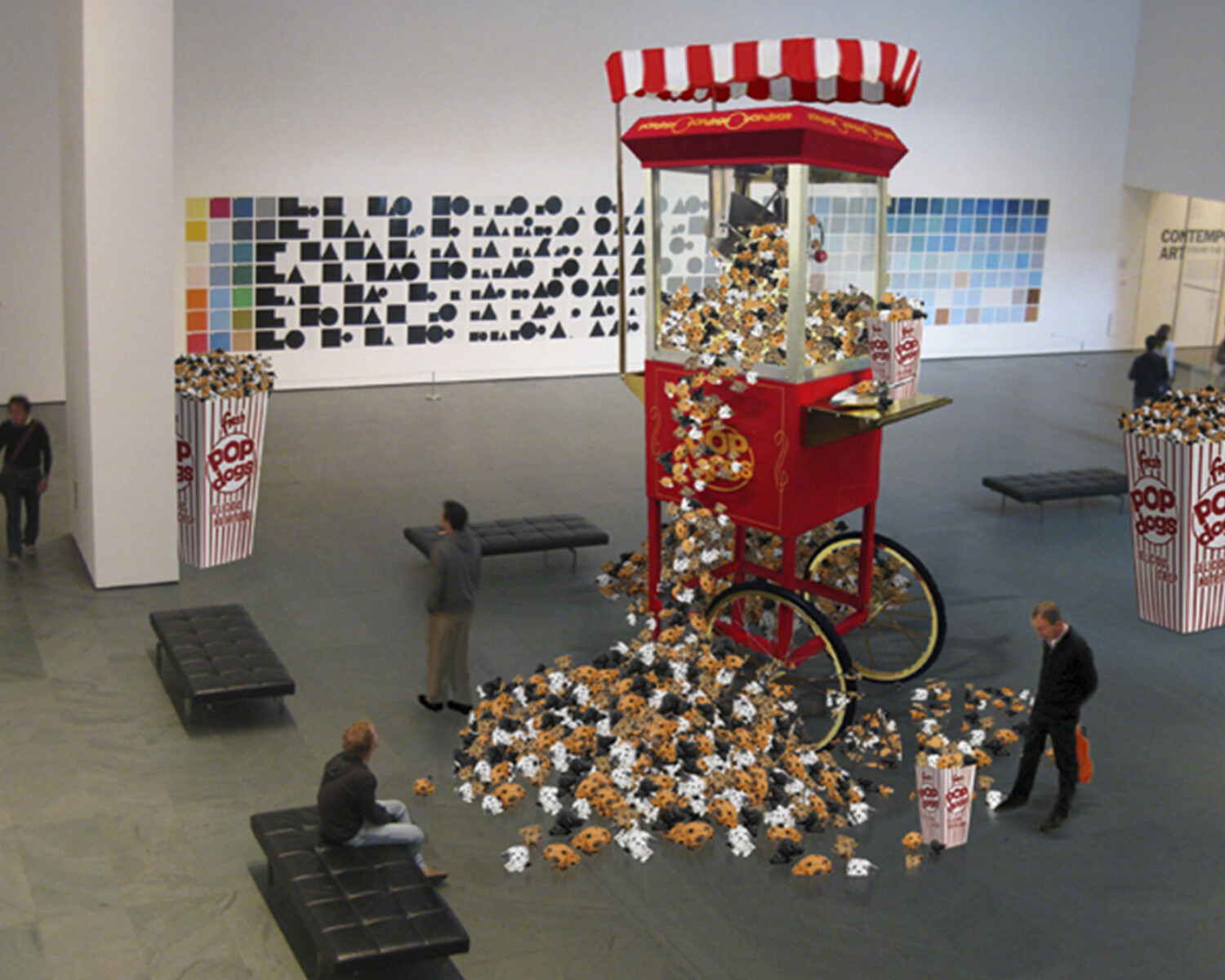 a large red and white cart with popcorn scattered on it. Carlo Sampietro