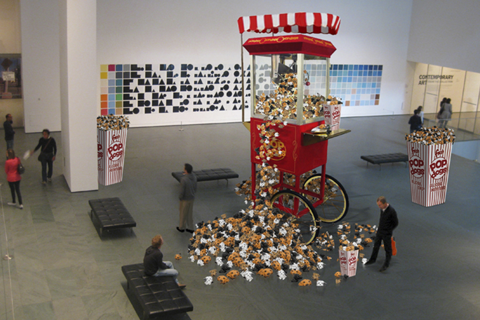 a large red and white cart with popcorn scattered on it. Carlo Sampietro