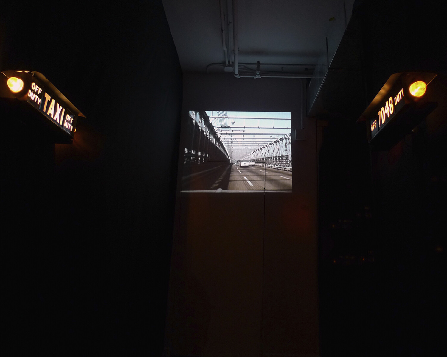 a picture of a road with a bridge in the background. Carlo Sampietro