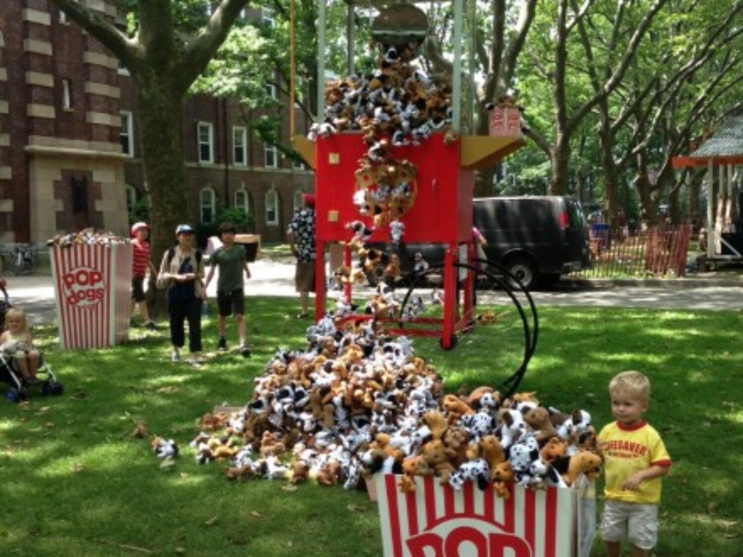a large red and white cart with popcorn scattered on it. Carlo Sampietro