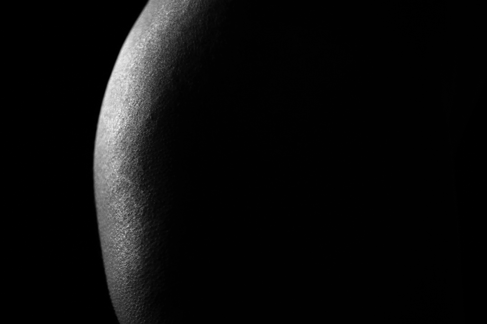 a close up of a black and white photo of a half moon. Carlo Sampietro