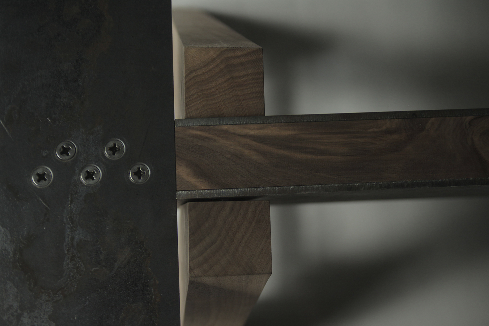 a close up of a wood and metal. Carlo Sampietro